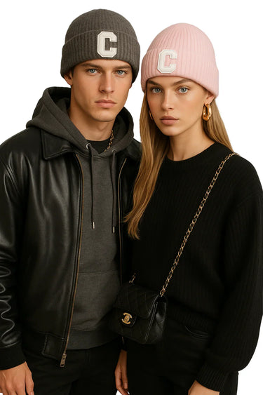 Two people wearing matching beanies with a 'C' logo, standing close together.